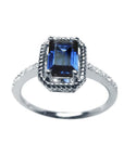 Women's sapphire solitaire ring medium light blue accent diamonds crafted in 14K white gold.