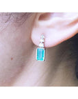 14K white gold earring with rectangular emerald and three round diamonds.