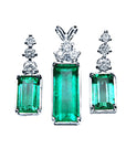 Set of natural emerald gemstone earrings with diamond tops on a front position top view