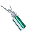 14K white gold pendant with a rectangular medium bluish-green emerald and accent diamonds.