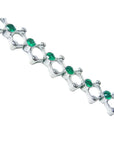 14K white gold bracelet with round Colombian emeralds bezel set in diamond-shaped links.