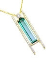 Yellow gold necklace with a natural baguette cut emerald gemstone pendant side natural diamonds.