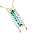 Yellow gold necklace with a natural baguette cut emerald gemstone pendant side natural diamonds.