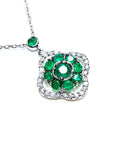 A natural emeralds necklace cluster set within a delicate 4-leaf clover design, crafted in 14k white gold and diamonds.