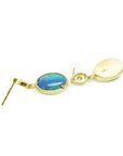 Oval bluish-green Australian opal earrings with dangling diamonds set in 14K yellow gold.