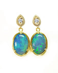 Australian opal earrings with gold setting on a topside view position.