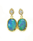 Bluish-green Australian opal earrings with dangling diamonds set in 14K yellow gold.