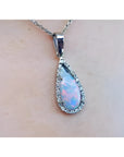 Pear-shaped Australian white opal pendant with red-orange play of color, set in 18k white gold with diamonds.