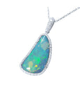 This solid Australian opal is surrounded by a halo of natural diamonds in a white gold frame pendant.