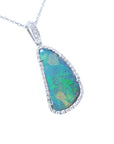 A solid Australian opal pendant necklace on a white gold and diamond frame displaying the topside.