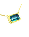 Women's emerald necklace solitaire style, Muzo Colombian origin east-west orientation handcrafted in 18k yellow gold