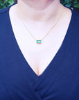 Brides' solitaire Emerald necklace east-west orientation handcrafted in 18k yellow gold