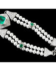 18K white gold emerald and pearl bracelet with diamonds, featuring a large bezel-set emerald.