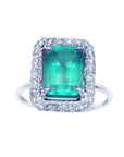 Emerald ring for women square halo diamond white gold, topside view.