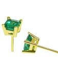 Pair of square emerald stud earrings in yellow gold, underside profile view.