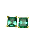 A pair of natural emerald stud earrings square cut, top side table and crown visibles.