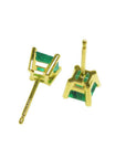 Pair of square emerald stud earrings in 14K yellow gold with basket settings.