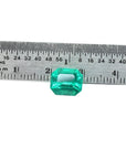 3.17 ct GIA certified natural Colombian Muzo Mine emerald, medium-deep green, shown with a ruler.