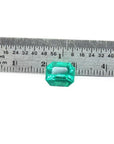 3.17 ct GIA certified natural Colombian Muzo Mine emerald, medium-deep green, shown with a ruler.