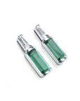 Two baguette cut emerald stud earrings with tapered baguette diamonds on top, white gold.