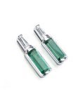 A pair of baguette cut natural emerald stud earrings with tapered baguette diamonds on top, 14k white gold.