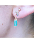 14K gold stud emerald leaf earrings with vibrant green rectangular emeralds and diamond accents.