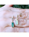 14K gold stud emerald leaf earrings with vibrant medium green rectangular emeralds and diamond accents.