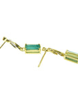 14K gold stud emerald leaf earrings with rectangular green emeralds and diamonds.