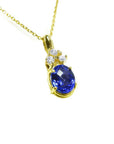 14K yellow gold pendant with oval tanzanite and three round diamonds on a delicate chain.