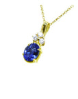 14K yellow gold pendant with oval tanzanite and three round diamonds.