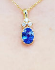 1.48 ct. natural tanzanite pendant with diamonds in 14K yellow gold.