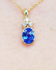 1.48 ct. natural tanzanite pendant with diamonds in 14K yellow gold.