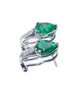 Pair of pear-shaped emerald clip-on earrings with diamond accents in 14K white gold.