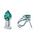 14K white gold clip-on earrings with pear-shaped emeralds and accent diamonds.