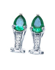 A pair of pear-cut Colombian emerald clip-on earrings crafted from 14k white gold.