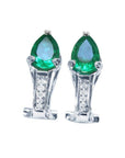 A pair of pear-cut Colombian emerald clip-on earrings crafted from 14k white gold.