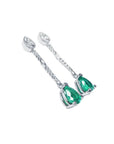 Pear-shaped emerald dangle earrings in 14K white gold with diamond accents.
