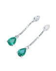 Pear-shaped Muzo Colombian emerald dangle earrings in 14K white gold with diamond accents.