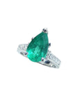 3.09 ct. pear-shaped deep bluish-green emerald ring with princess cut diamonds in 14K white gold.
