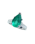 3.09 ct. pear-shaped deep bluish-green emerald ring with princess cut diamonds in 14K white gold.