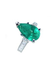 3.09 ct pear-shaped deep bluish-green emerald ring with princess-cut diamonds in 14K white gold.