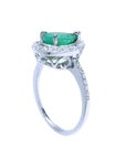 The underside profile view of this natural colombian emerald ring in white gold.