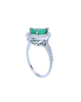 1.39 ct. teardrop emerald ring in 14K white gold with diamond halo and pavé band.