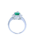 14K white gold teardrop halo ring with a vibrant green emerald and diamond accents.