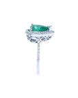 1.39 ct. teardrop emerald ring with diamond halo on 14K white gold band.