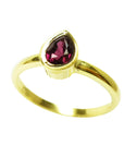 14K yellow gold solitaire ring with a vibrant teardrop natural ruby.
