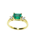 1.01 ct rectangular emerald ring with two round natural diamonds set in 14K yellow gold.