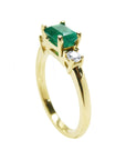 A side profile perspective of this natural emerald ring crafted in 14K white gold