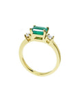 1.01 ct rectangular emerald ring with natural diamond side accents in 14K yellow gold.