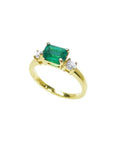 1.01 ct rectangular emerald ring with natural diamond accents in 14K yellow gold.